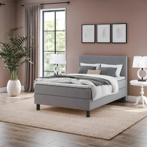 Современная спальная система Gerda 140x200 серого цвета с мягким изголовьем в уютной спальне, стильный дизайн.