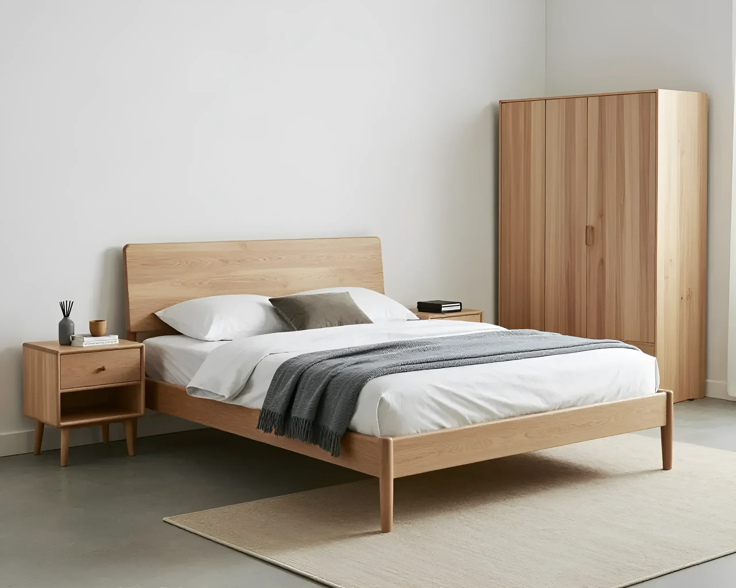 Scandinavian-style bedroom set: wooden bed with headboard, bedside table, and tall wardrobe