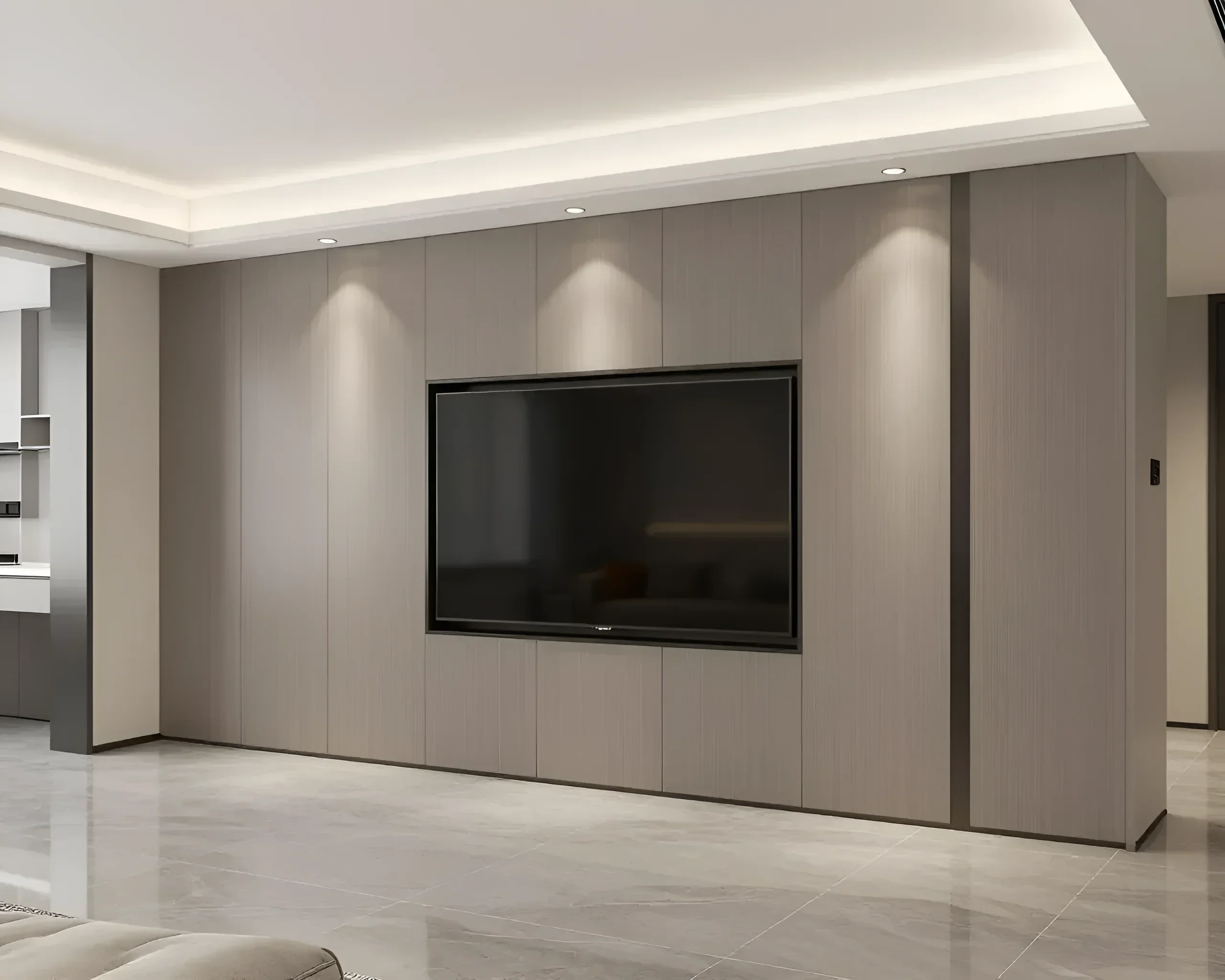 Moderner Einbauschrank in Wandfarbe mit integrierter TV-Nische, der den Effekt eines einheitlichen Raumes erzeugt.