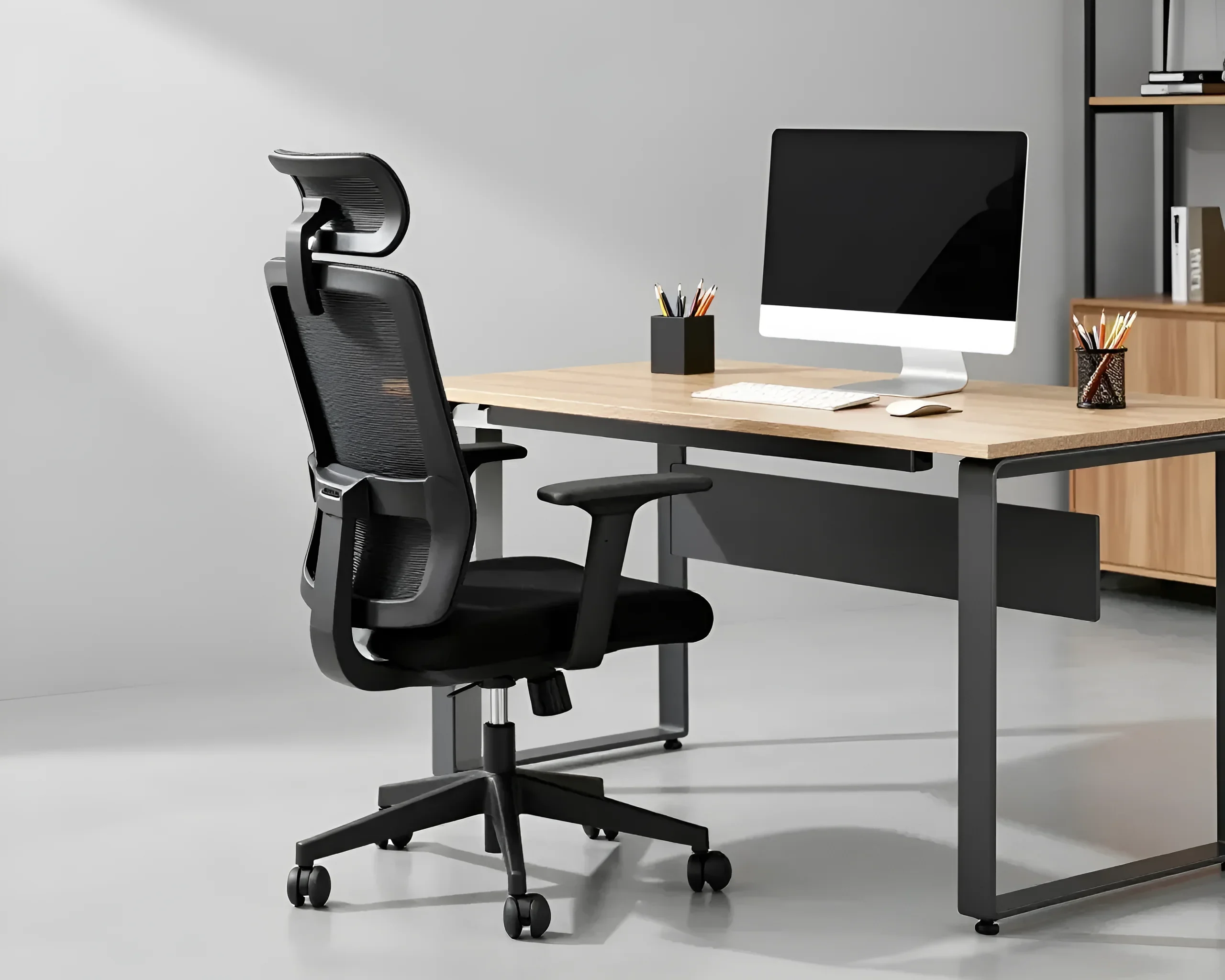 Ergonomic office desk with an adjustable chair and computer, demonstrating a comfortable workspace.