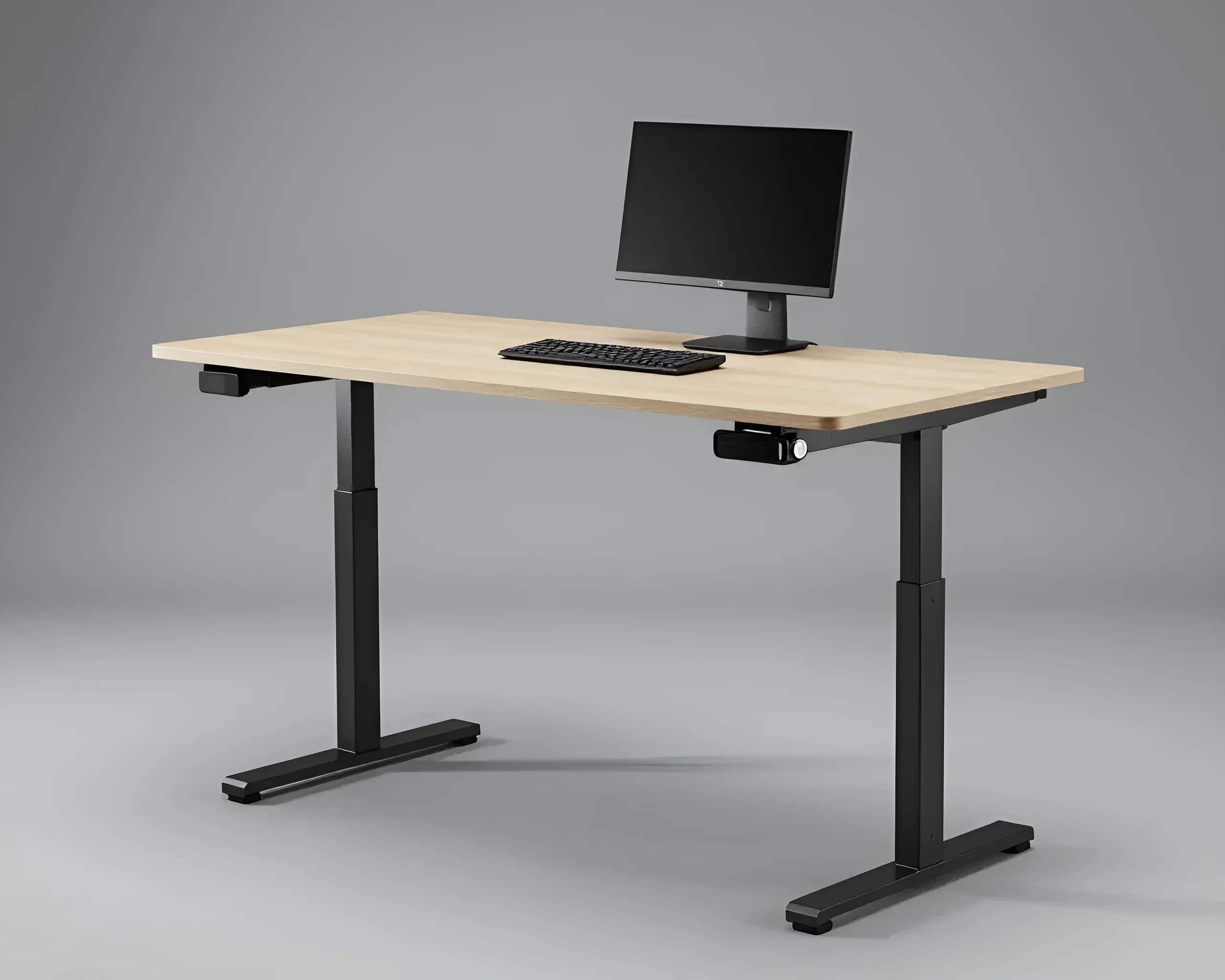 Modern office desk with adjustable height, wood-look tabletop, and black metal frame, with monitor and keyboard.
